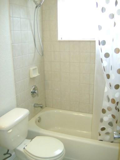 2301 Southwest 50th Terrace Plantation, FL 33317 - Photo 16 of 26 a bathroom with a toilet and a bathtub