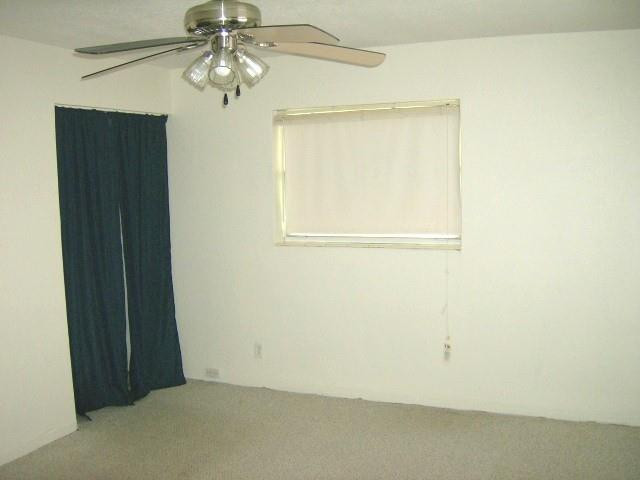 2301 Southwest 50th Terrace Plantation, FL 33317 - Photo 19 of 26 an empty room with a window and a fan