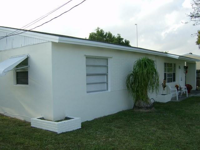 2301 Southwest 50th Terrace Plantation, FL 33317 - Photo 5 of 26 a view of a backyard with plants and a patio