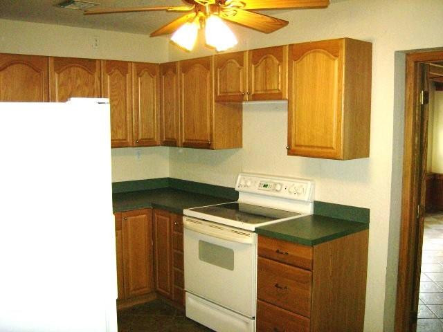 2301 Southwest 50th Terrace Plantation, FL 33317 - Photo 8 of 26 a kitchen with a sink and cabinets
