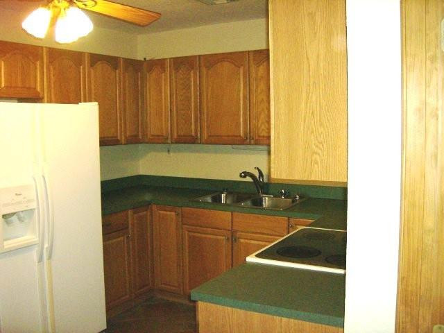 2301 Southwest 50th Terrace Plantation, FL 33317 - Photo 9 of 26 a kitchen with a sink and a refrigerator