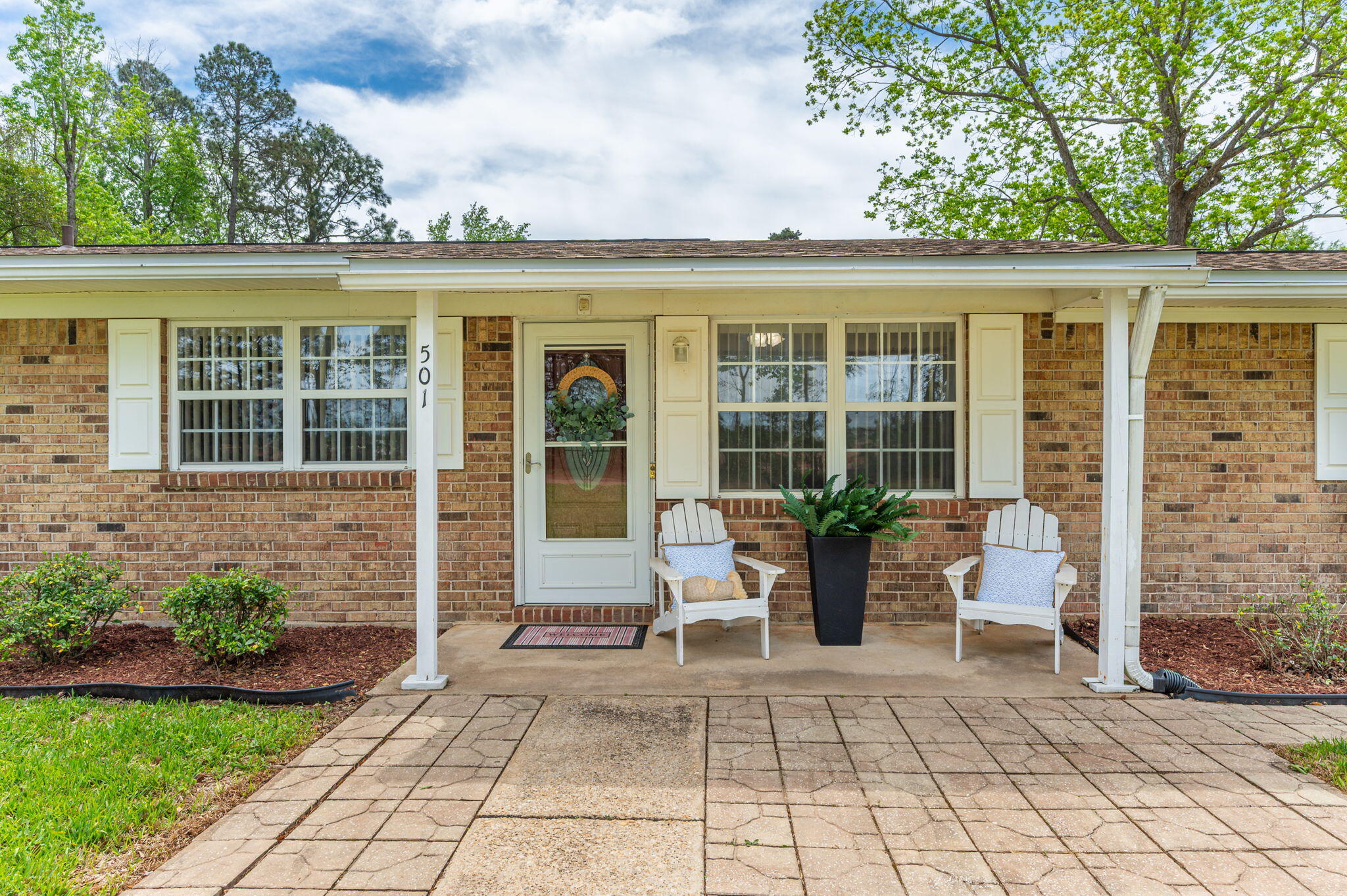 501 Jones Road Crestview, FL 32536 - Photo 3 of 32 a view of house with patio outdoor seating and plants