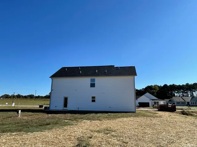 a backyard of a house with a yard
