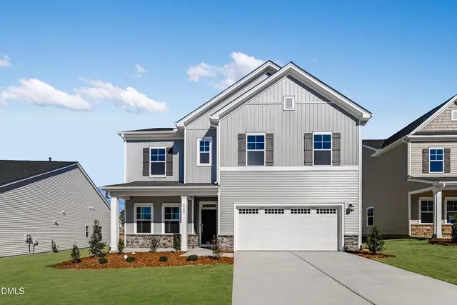 a kitchen with stainless steel appliances a refrigerator and a stove top oven