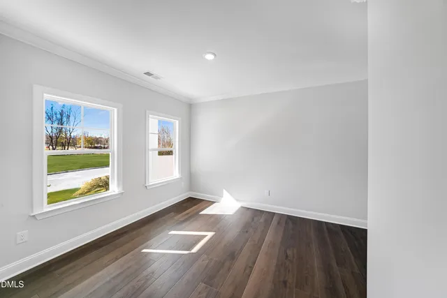 a bathroom with a double vanity sink toilet and a mirror