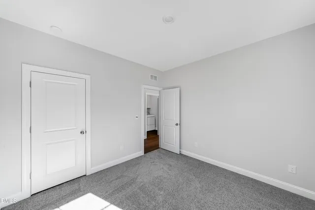 a empty closet with white paint