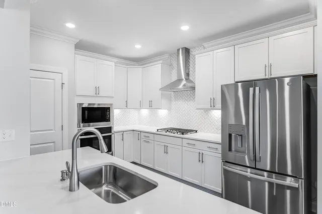 a kitchen with cabinets and a stove