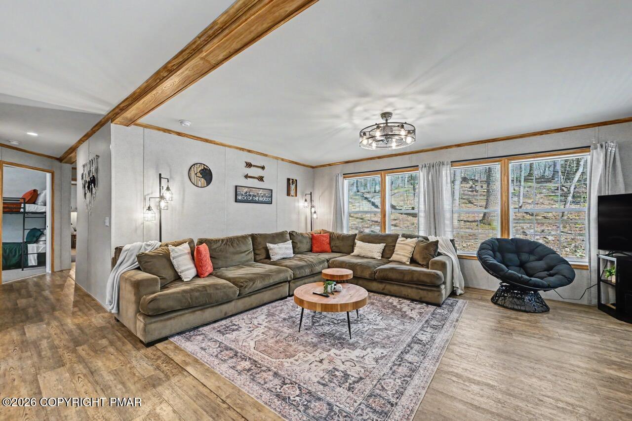 2194 Snow Hill Falls Road Cresco, PA 18326 - Photo 21 of 63 a living room with furniture and a large window