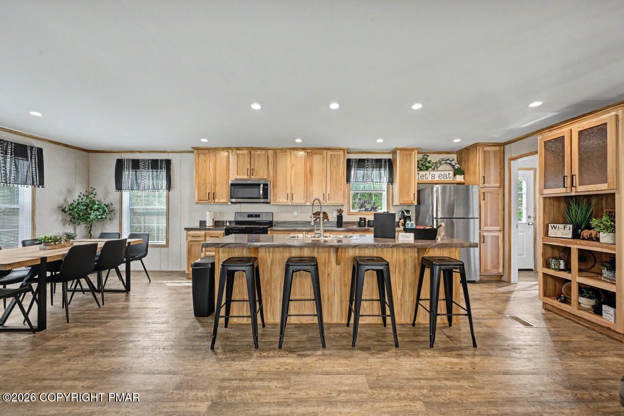 2194 Snow Hill Falls Road Cresco, PA 18326 - Photo 27 of 63 a kitchen with a dining table chairs appliances and cabinets