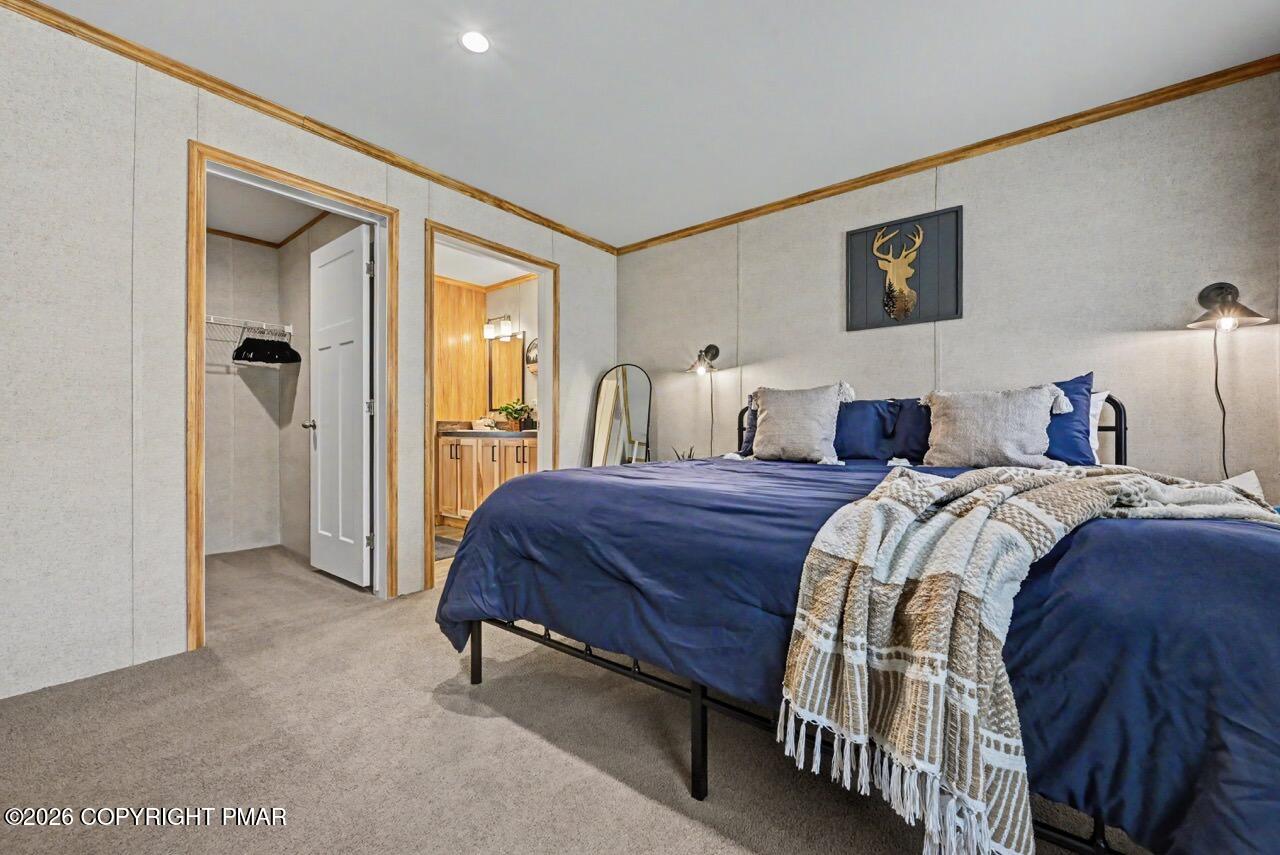 2194 Snow Hill Falls Road Cresco, PA 18326 - Photo 39 of 63 a spacious bedroom with a bed and a cabinets