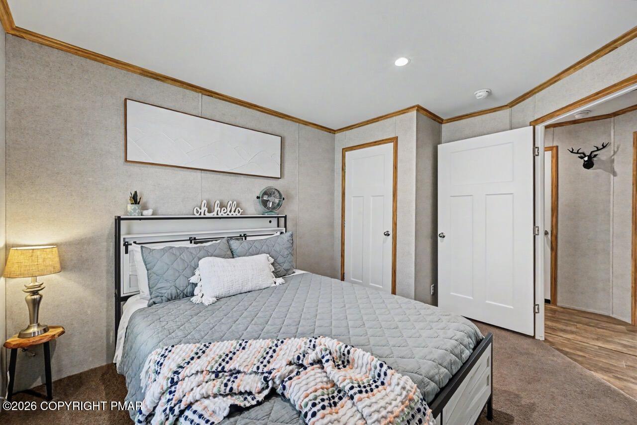 2194 Snow Hill Falls Road Cresco, PA 18326 - Photo 50 of 63 a bedroom with a bed and wooden floor