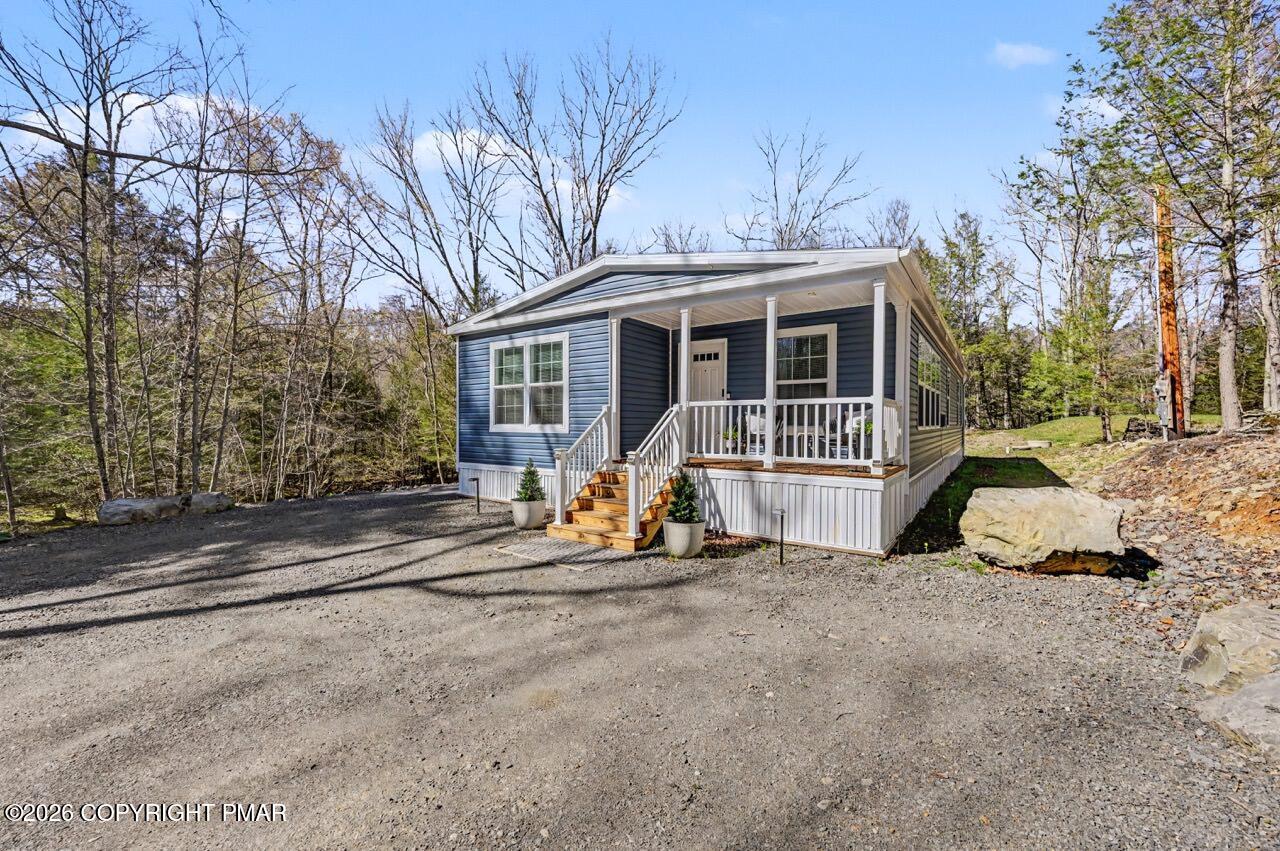 2194 Snow Hill Falls Road Cresco, PA 18326 - Photo 55 of 63 a view of a house with backyard and trees