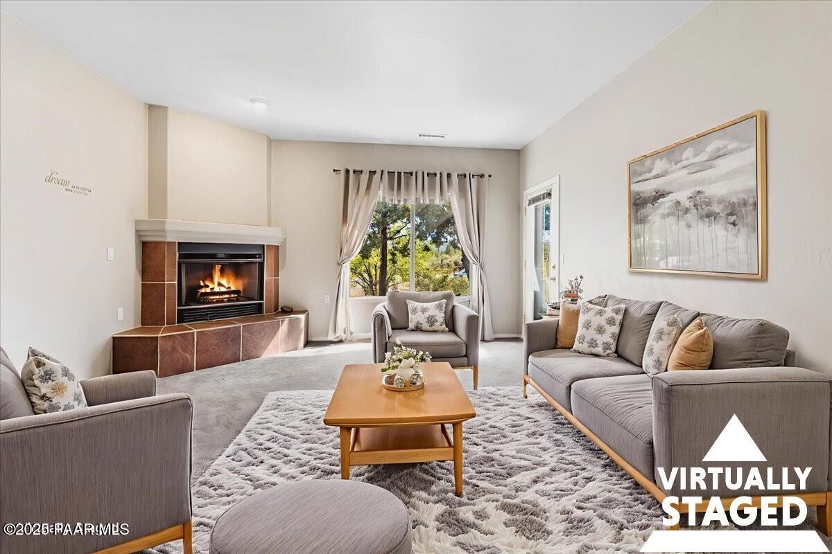 4976 Summit Circle Prescott, AZ 86301 - Photo 2 of 16 a living room with furniture and a fireplace