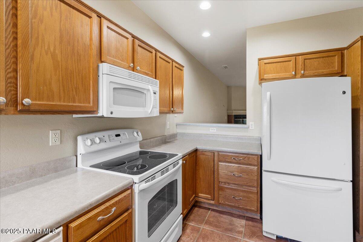 4976 Summit Circle Prescott, AZ 86301 - Photo 8 of 16 a kitchen with a stove and a refrigerator