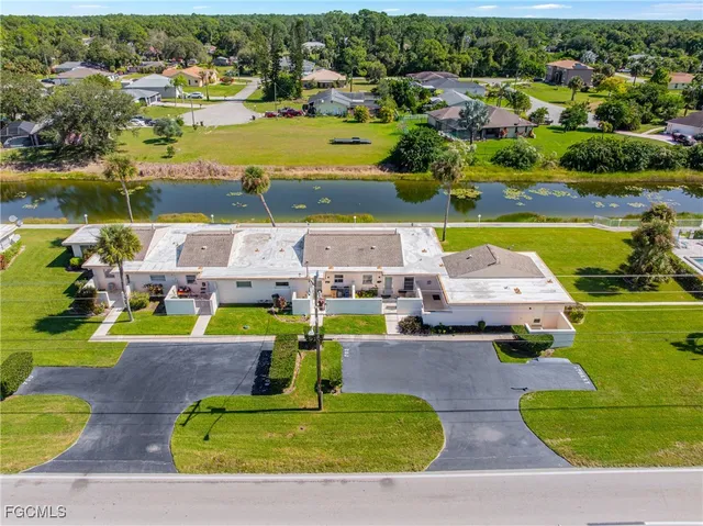 an aerial view of a house with a swimming pool yard and outdoor seating