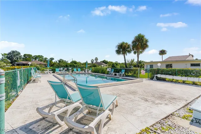 a view of a terrace with a bench and lake view