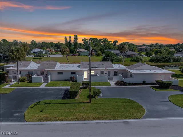 a view of house with a big yard
