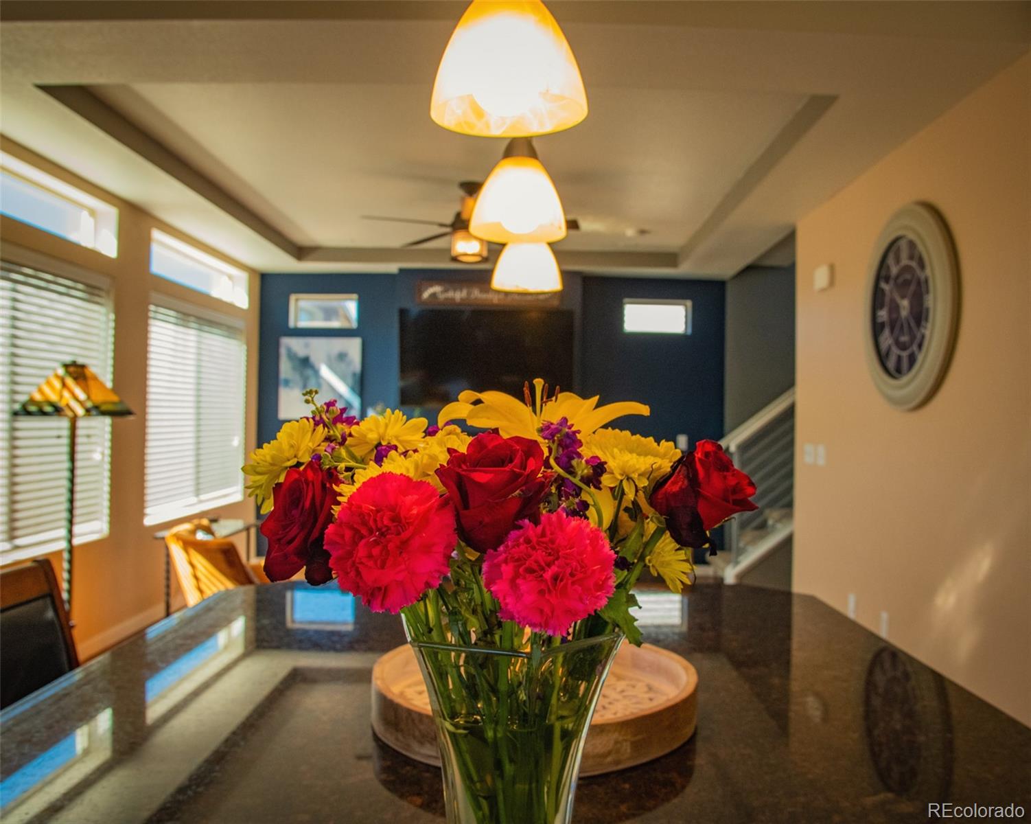 4428 Vindaloo Drive Castle Rock, CO 80109 - Photo 11 of 35 a vase of flowers sitting on a table with window