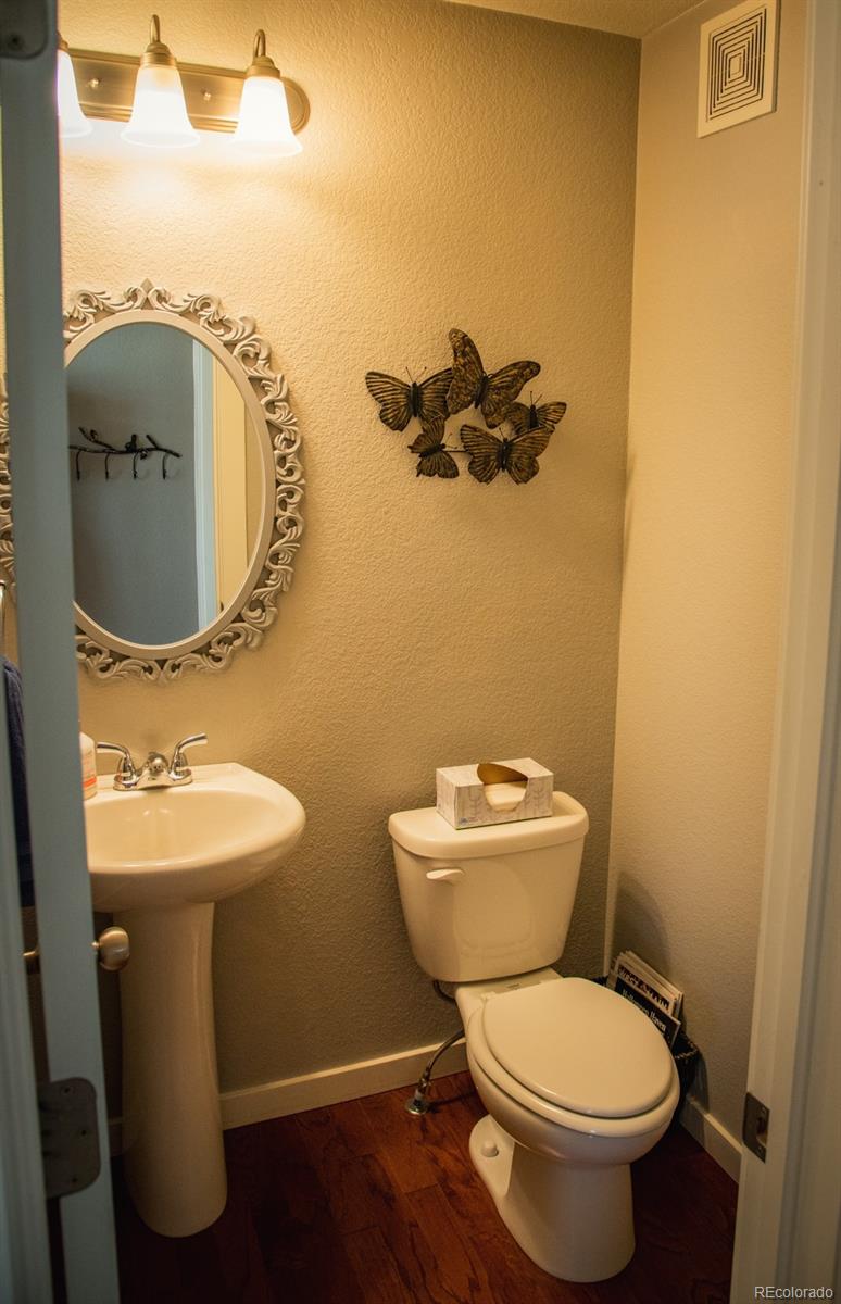 4428 Vindaloo Drive Castle Rock, CO 80109 - Photo 15 of 35 a bathroom with a toilet sink and mirror