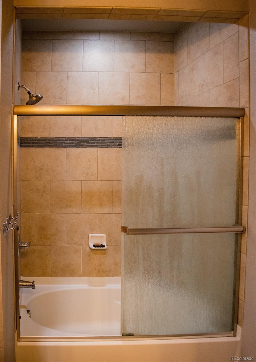 4428 Vindaloo Drive Castle Rock, CO 80109 - Photo 19 of 35 a bathroom with a shower