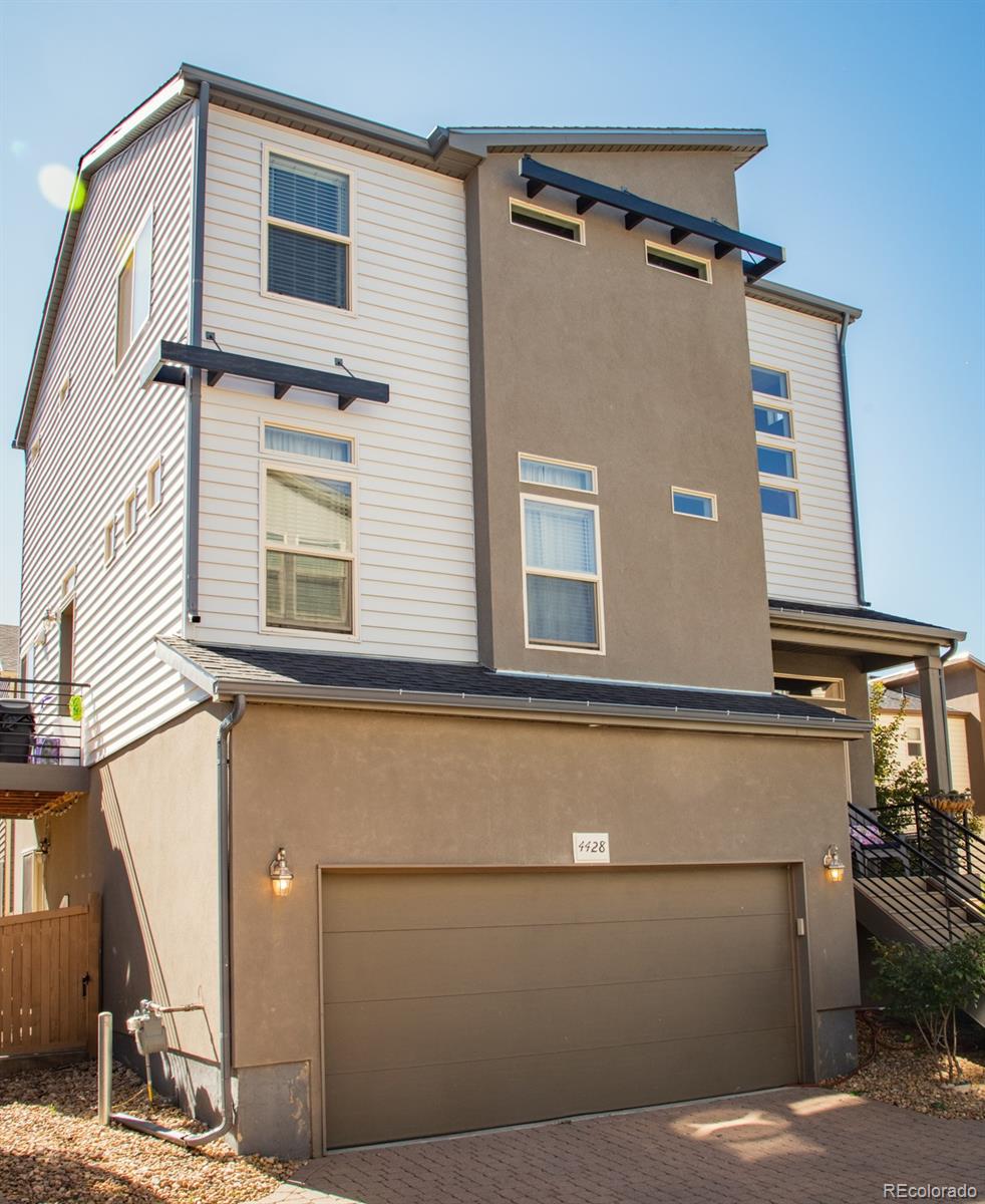 4428 Vindaloo Drive Castle Rock, CO 80109 - Photo 2 of 35 a view of a house with a street