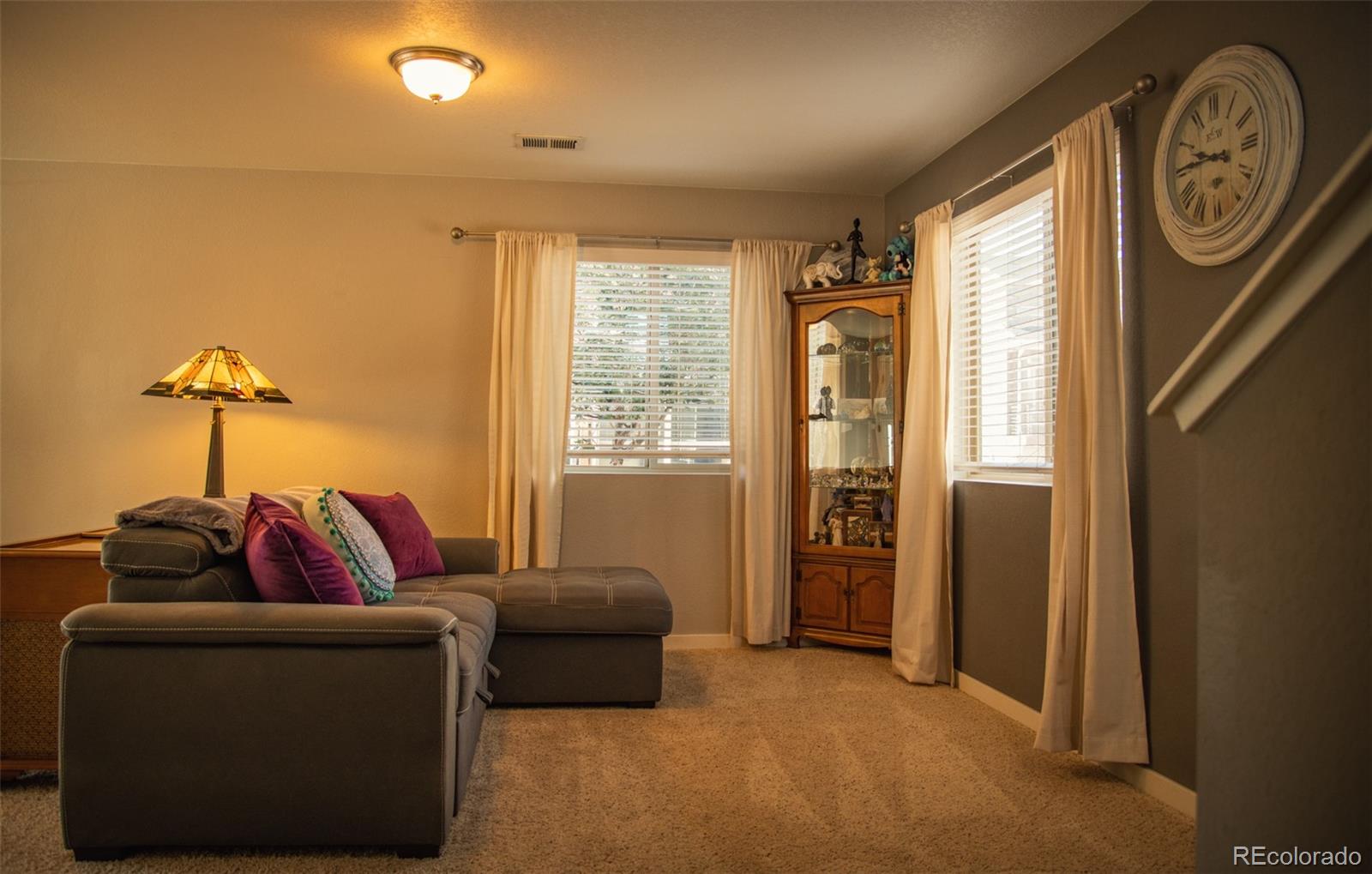 4428 Vindaloo Drive Castle Rock, CO 80109 - Photo 26 of 35 a living room with furniture and a window