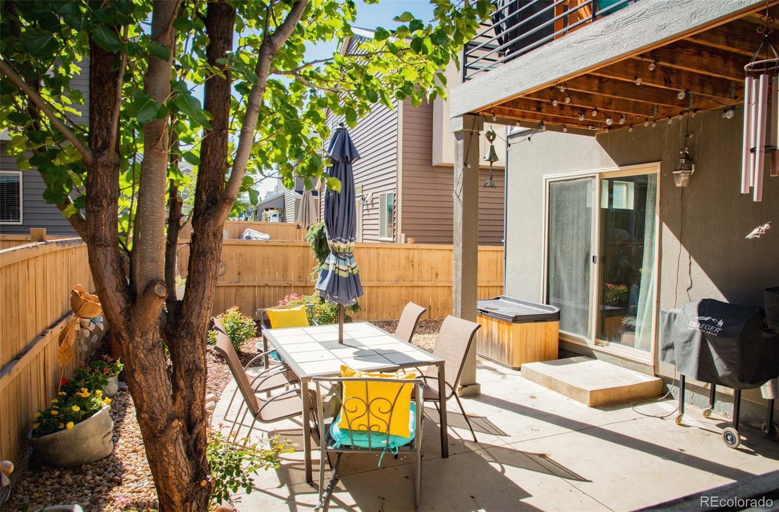 4428 Vindaloo Drive Castle Rock, CO 80109 - Photo 27 of 35 a view of a patio with table and chairs and potted plants