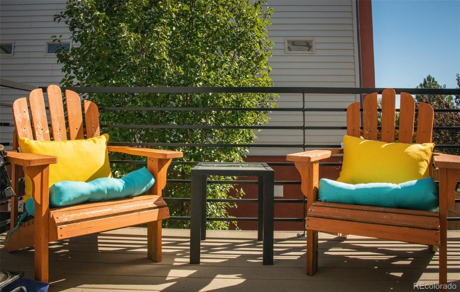4428 Vindaloo Drive Castle Rock, CO 80109 - Photo 31 of 35 a view of a wooden chairs and table in the back yard
