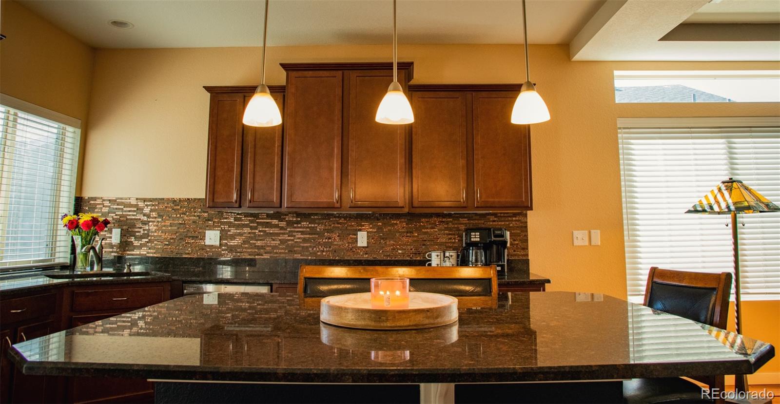 4428 Vindaloo Drive Castle Rock, CO 80109 - Photo 8 of 35 a bathroom with a double vanity sink and a mirror