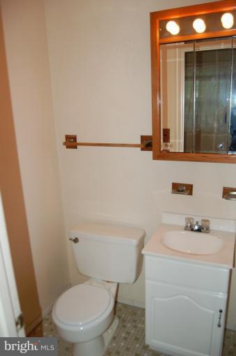 18916 Olney Mill Road Olney, MD 20832 - Photo 2 of 24 a white toilet sitting next to a bathroom sink