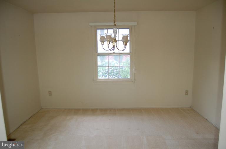 18916 Olney Mill Road Olney, MD 20832 - Photo 17 of 24 an empty room with windows and chandelier fan