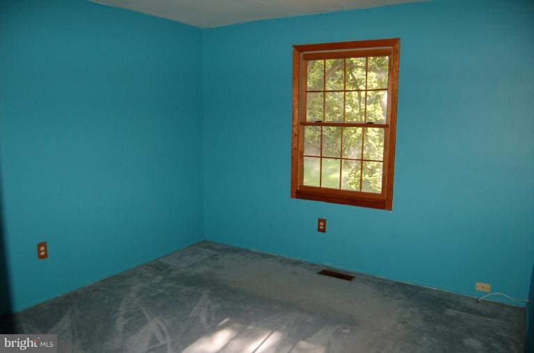 18916 Olney Mill Road Olney, MD 20832 - Photo 3 of 24 a view of an empty room with a window