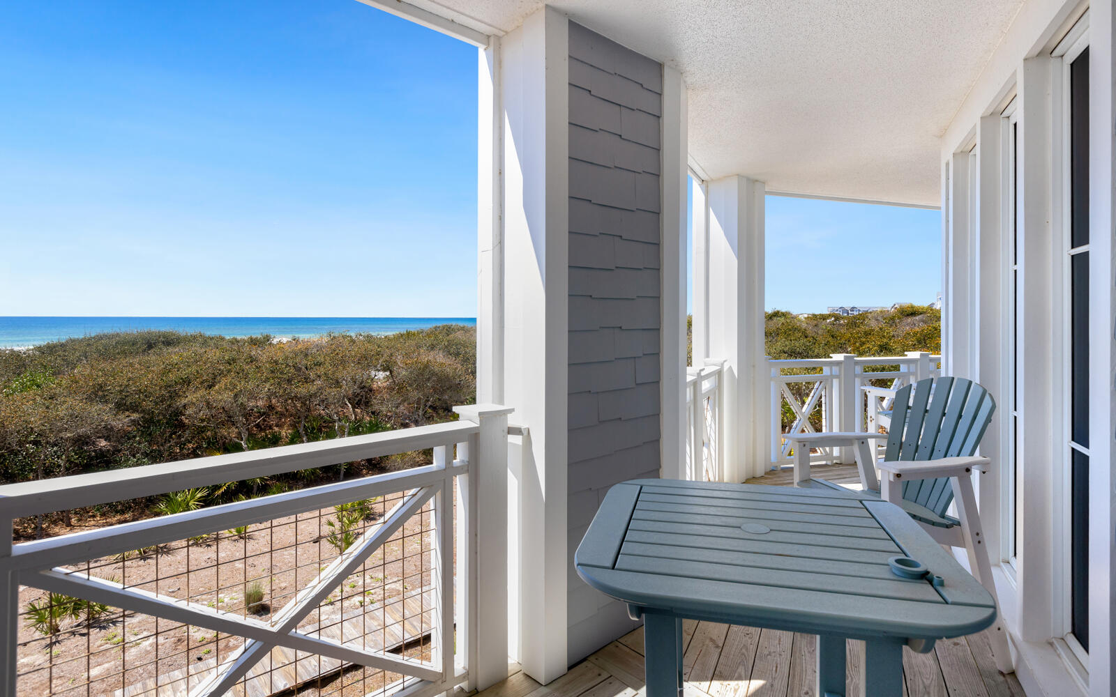 100 Bridge Lane, Unit 214C Inlet Beach, FL 32461 - Photo 24 of 54 a view of balcony with wooden floor and outdoor seating
