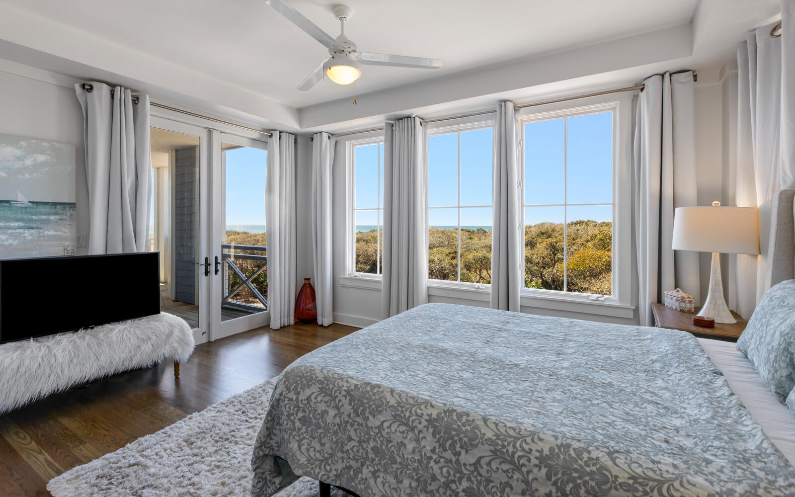 100 Bridge Lane, Unit 214C Inlet Beach, FL 32461 - Photo 34 of 54 a spacious bedroom with a large bed and a flat screen tv