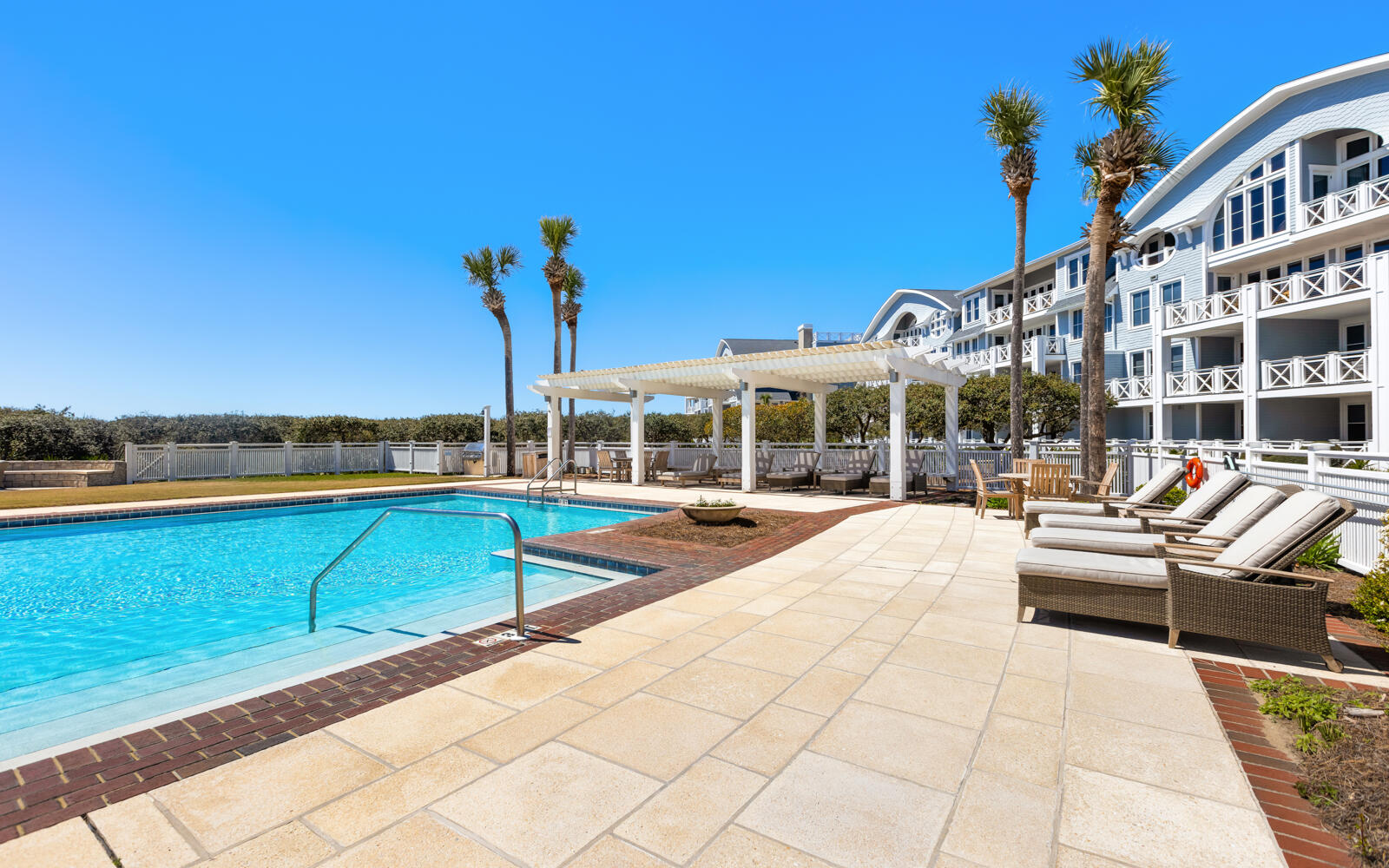 100 Bridge Lane, Unit 214C Inlet Beach, FL 32461 - Photo 44 of 54 a view of a building with a swimming pool and sitting area