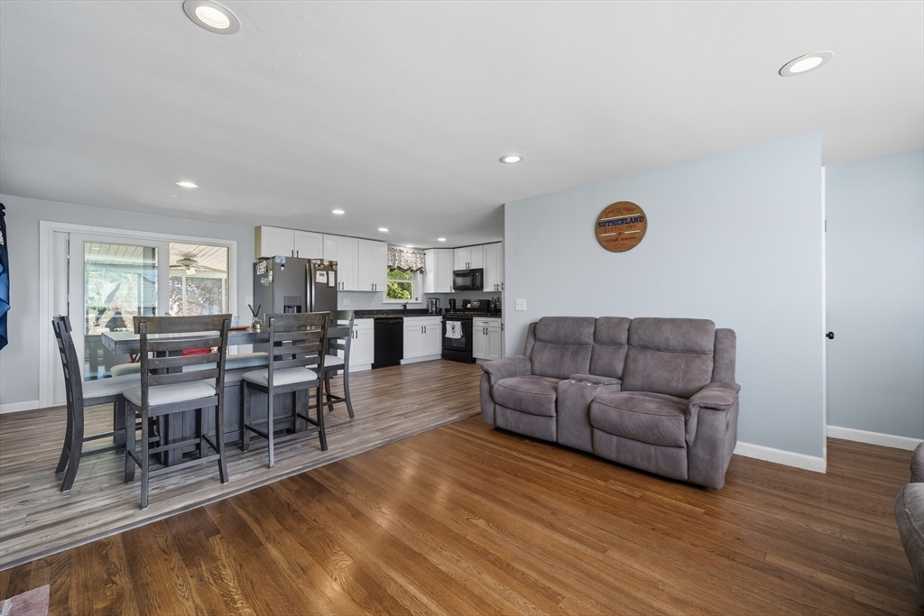 35 Oak Ridge Circle Lynn, MA 01904 - Photo 11 of 37 a living room with furniture a wooden floor and dining table