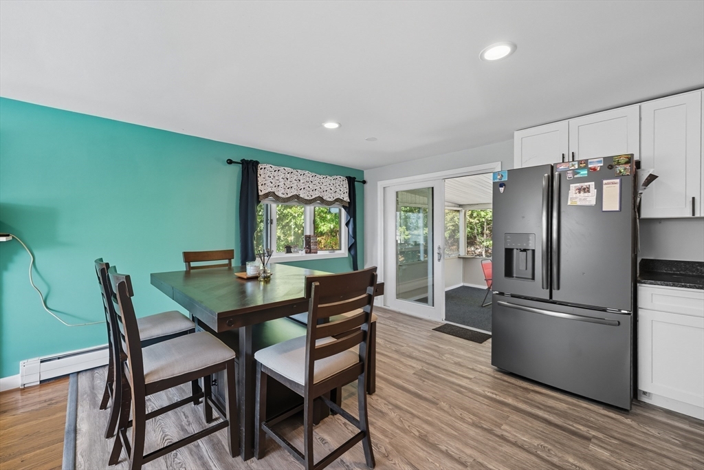 35 Oak Ridge Circle Lynn, MA 01904 - Photo 12 of 37 a view of a dining room with furniture a kitchen and wooden floor