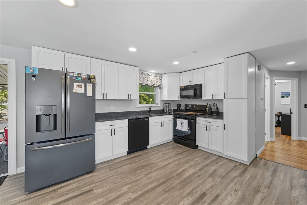 35 Oak Ridge Circle Lynn, MA 01904 - Photo 14 of 37 a kitchen with granite countertop a refrigerator stove top oven and sink