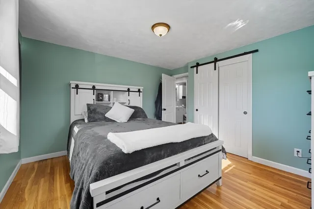 a bed room with a bed and a window