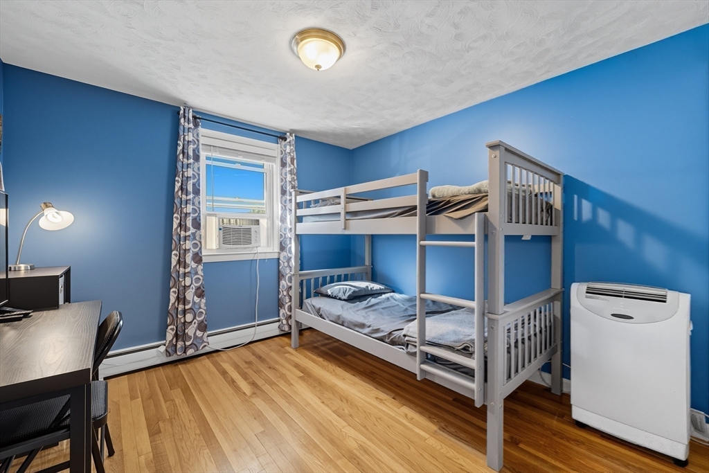 35 Oak Ridge Circle Lynn, MA 01904 - Photo 21 of 37 a bedroom with a bunk bed and a desk