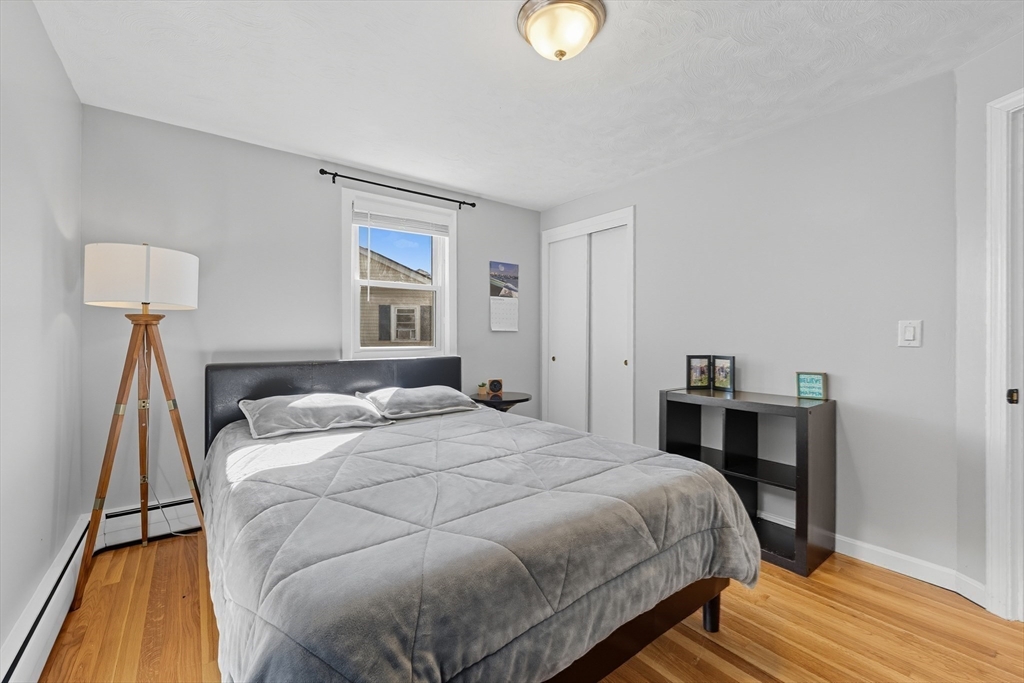 35 Oak Ridge Circle Lynn, MA 01904 - Photo 23 of 37 a bedroom with a bed and a lamp