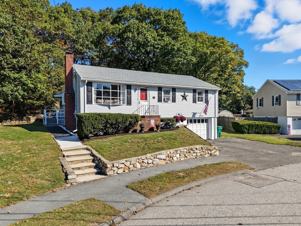 35 Oak Ridge Circle Lynn, MA 01904 - Photo 3 of 37 a front view of a house with a yard