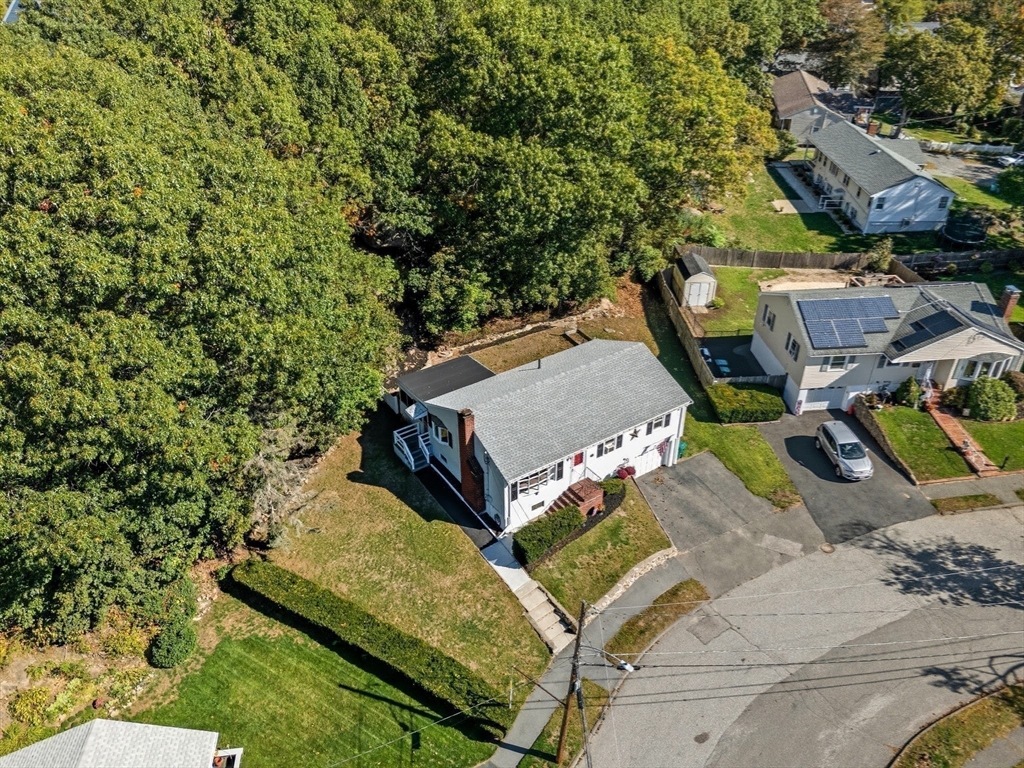 35 Oak Ridge Circle Lynn, MA 01904 - Photo 32 of 37 a view of a backyard with chairs
