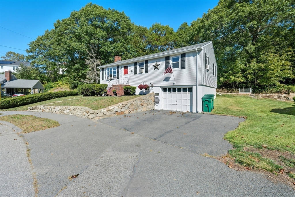 35 Oak Ridge Circle Lynn, MA 01904 - Photo 4 of 37 a view of a house with a yard and large tree