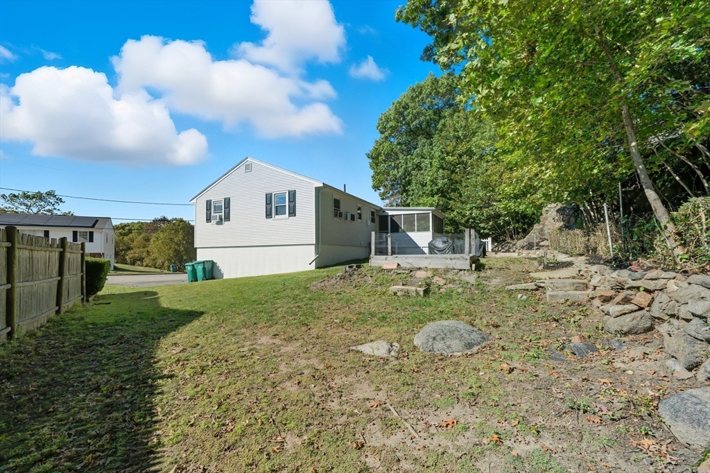 35 Oak Ridge Circle Lynn, MA 01904 - Photo 5 of 37 a view of a house with a yard