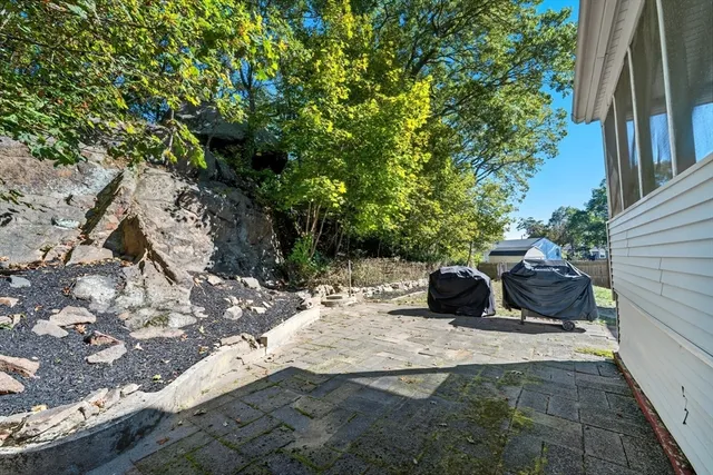 a view of a bench in a backyard