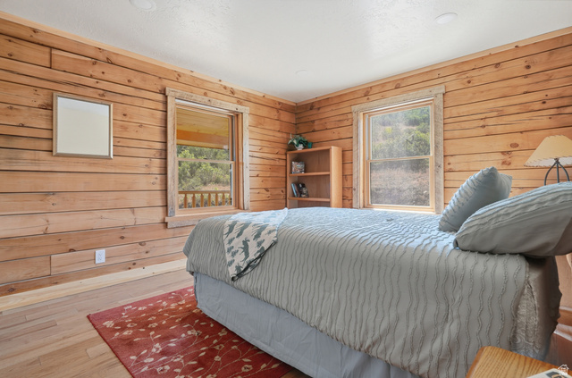 20 Q Puma Road Fairview, UT 84629 - Photo 11 of 27 Wood-paneled room featuring natural light from two windows and light wood-finish flooring