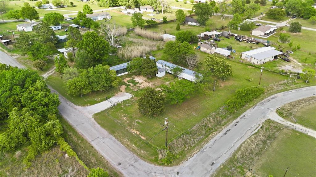 316 Summit Drive Springtown, TX 76082 - Photo 34 of 39 This property features extensive green spaces, mature trees, and direct access to paved roads