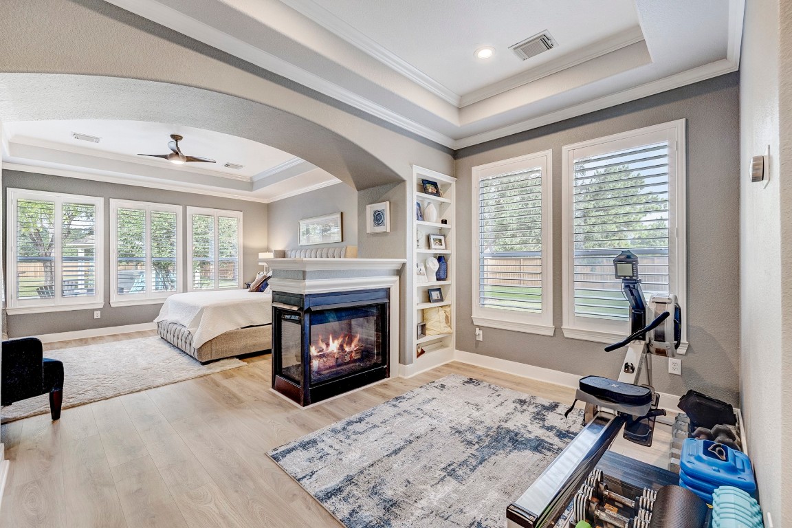 2600 Silverstone Way Conroe, TX 77304 - Photo 22 of 49 a living room with furniture and a fireplace