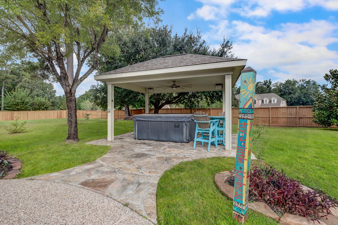 2600 Silverstone Way Conroe, TX 77304 - Photo 41 of 49 a view of a house with backyard and a patio